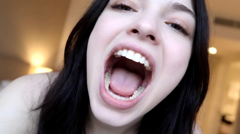 Editorial close-up of an open human mouth used as a featured image for an informational article about the online search term "giantess vore POV."