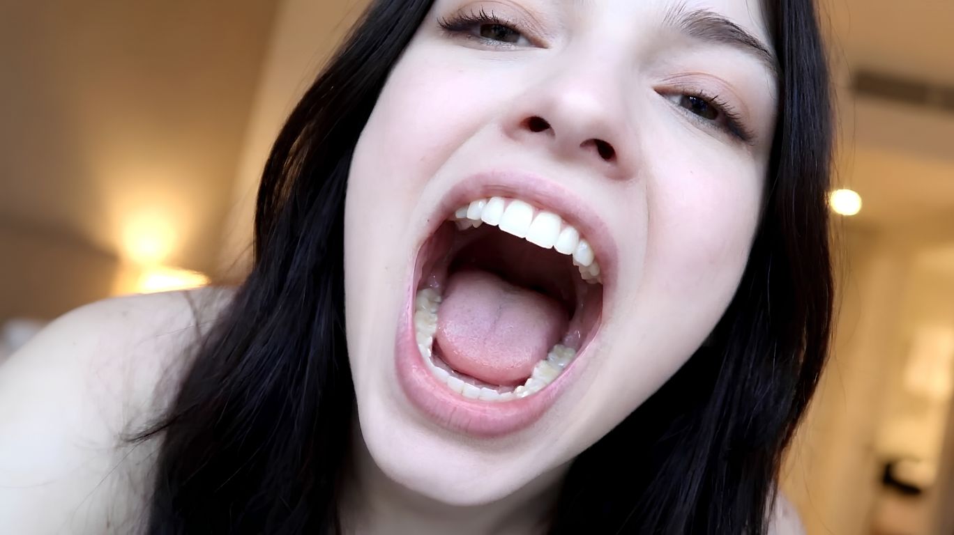 Editorial close-up of an open human mouth used as a featured image for an informational article about the online search term 